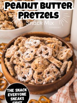 Bowl of sweet and salty Peanut Butter Pretzel Snack Mix coated in powdered sugar, perfect for parties or gifting.