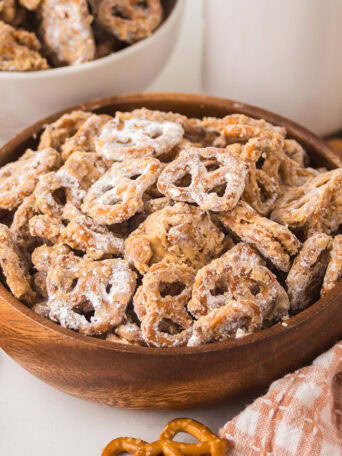 Peanut Butter Pretzel Snack Mix ready to enjoy in a wood bowl