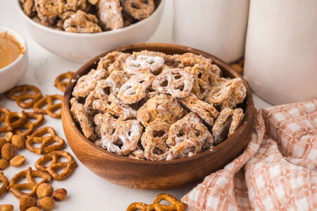 Peanut Butter Pretzel Snack Mix ready to enjoy in a wood bowl
