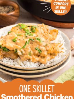 Plated creamy smothered chicken with Parmesan sauce and parsley, ready to serve.