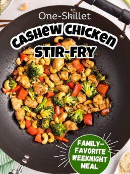 Close-up of Cashew Chicken Stir Fry in a wok with broccoli, red bell peppers, and cashews tossed in a glossy, homemade sauce.