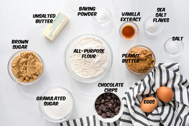 Ingredients for making peanut butter blondies arranged on a kitchen counter.