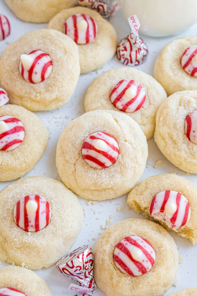 Large batch of Candy Cane Kiss Cookies displayed on the counter for holiday snacking