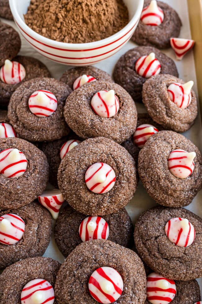 Close-up of Chocolate Peppermint Kiss Cookies showing the fudgy texture and striped candy cane Kisses.