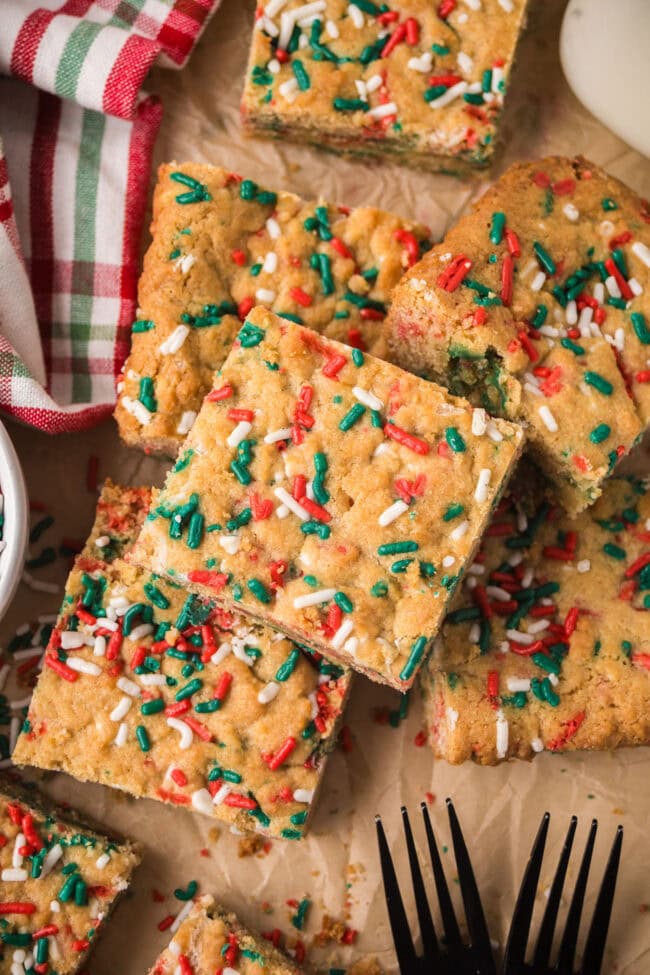 A plate of Christmas Blondies arranged for serving, topped with red and green sprinkles.