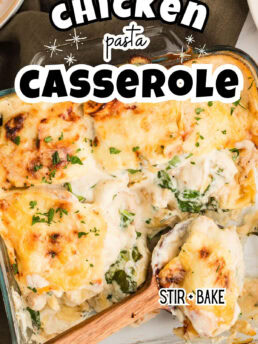 Creamy Chicken Tortellini Casserole in a square glass baking dish, ready to serve with a wooden spoon.