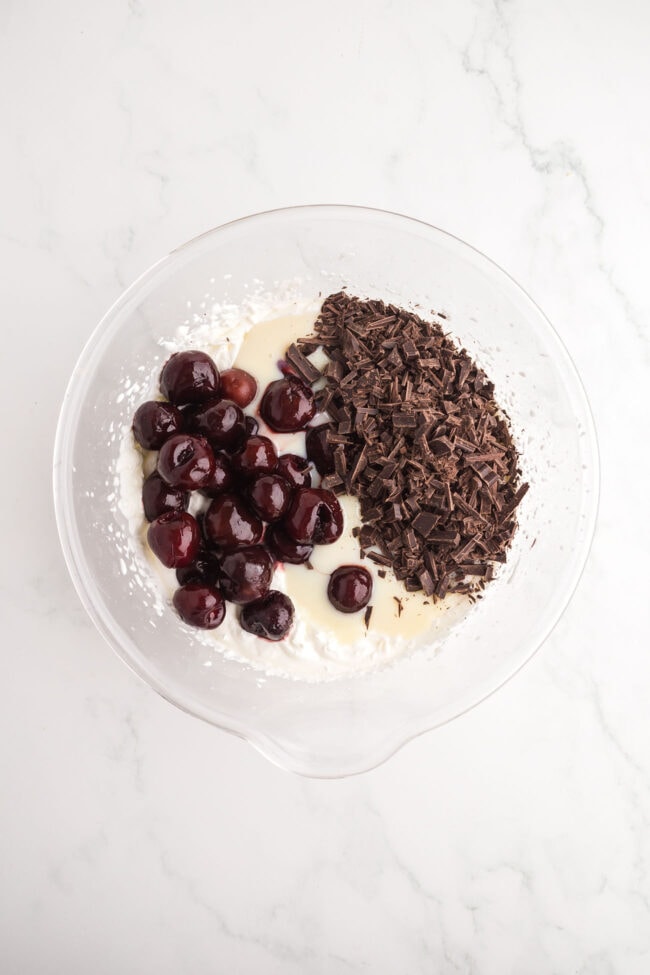 whipped cream mixture with cherries and chocolate for homemade Cherry Garcia ice cream