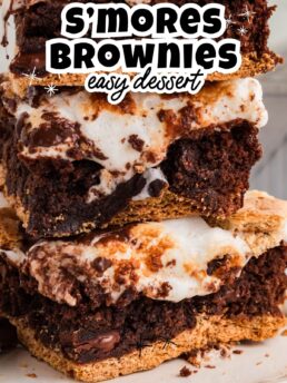 stacked s’mores brownies with graham cracker crust, gooey marshmallow topping, and melted chocolate