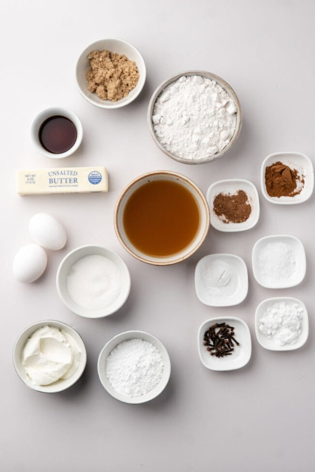 Ingredients for homemade Apple Cider Bread arranged on a white surface