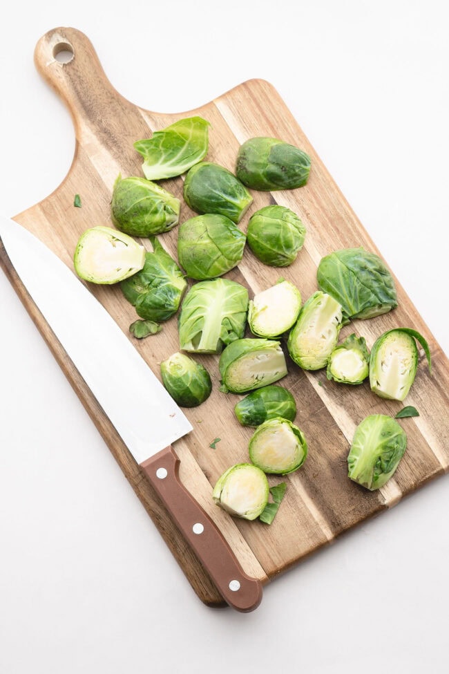 Fresh sprouts trimmed and halved on a cutting board
