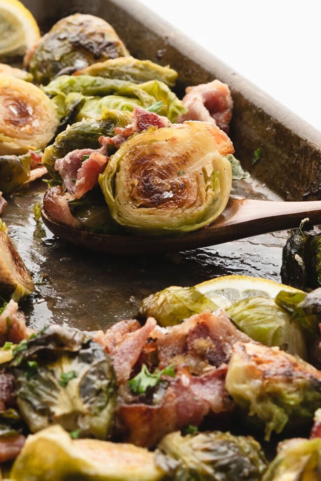 Close-up of crispy maple bacon Brussels sprouts on a serving spoon