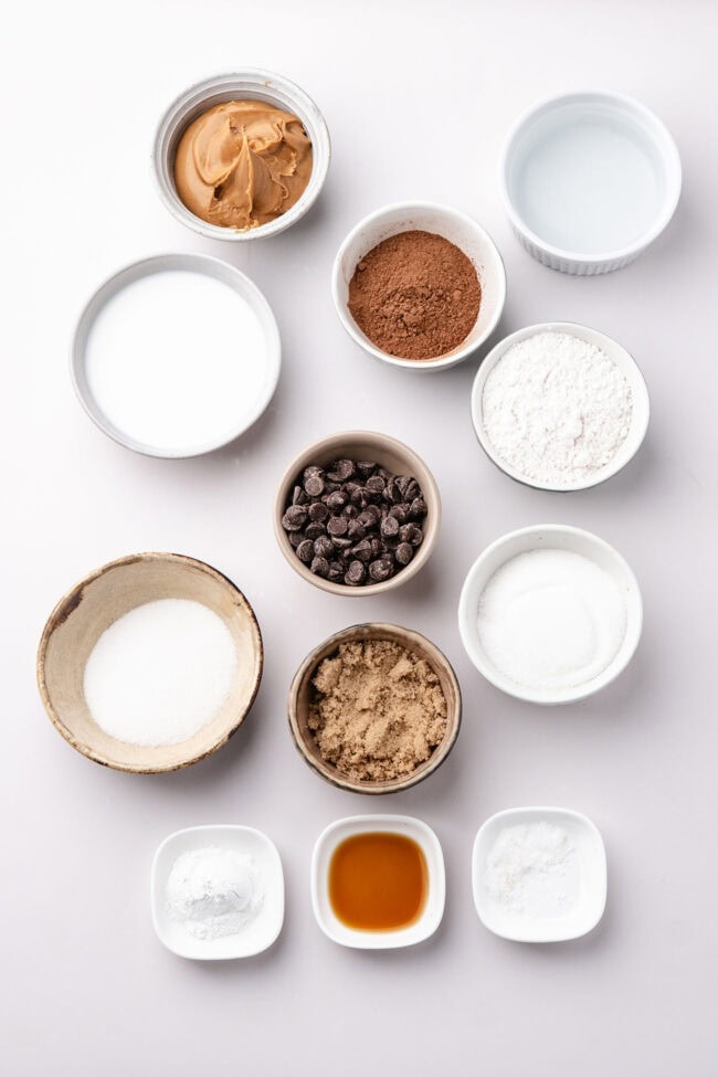 Ingredients for chocolate cobbler with peanut butter arranged in bowls